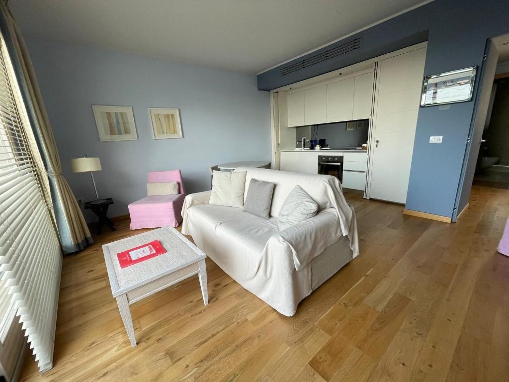 A bed or beds in a room at Appartamenti Vacanze Marina di Scarlino