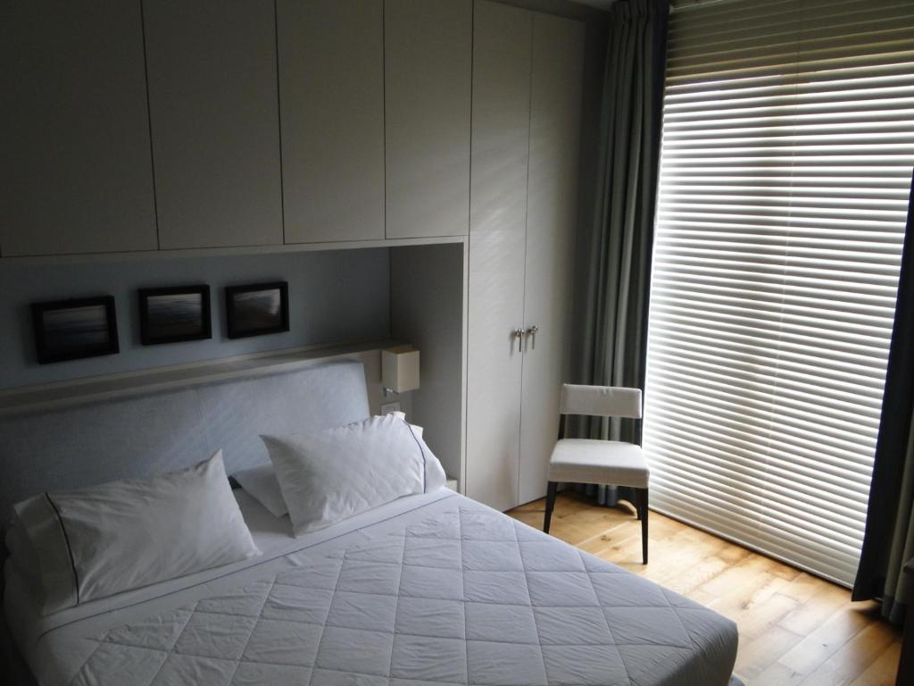 A bed or beds in a room at Appartamenti Vacanze Marina di Scarlino
