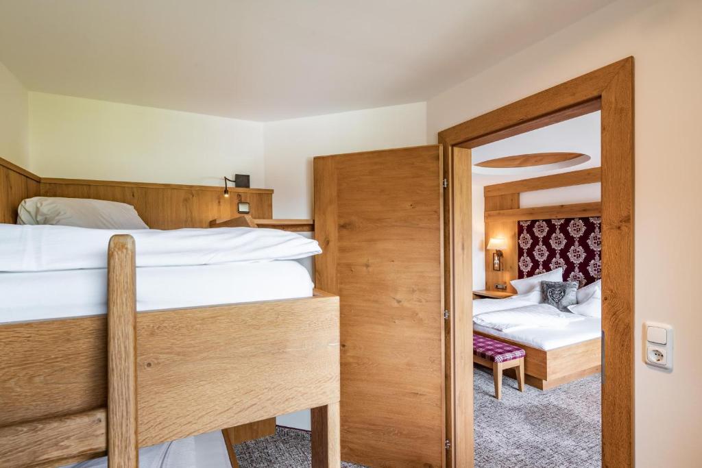 Postel nebo postele na pokoji v ubytování Hotel Pramstraller