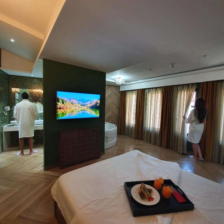 TV a/nebo společenská místnost v ubytování Dream House Hotel & Spa
