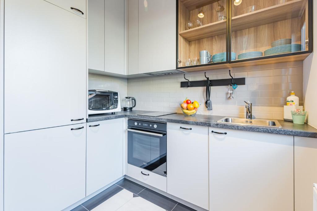 Kuchyňa alebo kuchynka v ubytovaní Grobla by Loft Apartments