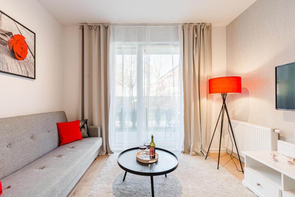 Televízia a/alebo spoločenská miestnosť v ubytovaní Grobla by Loft Apartments