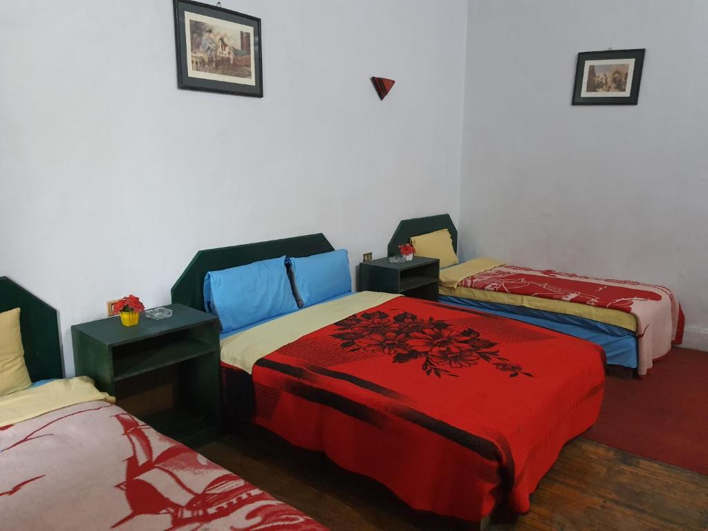 Postel nebo postele na pokoji v ubytování African House Hostel