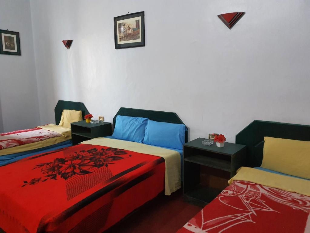 Postel nebo postele na pokoji v ubytování African House Hostel
