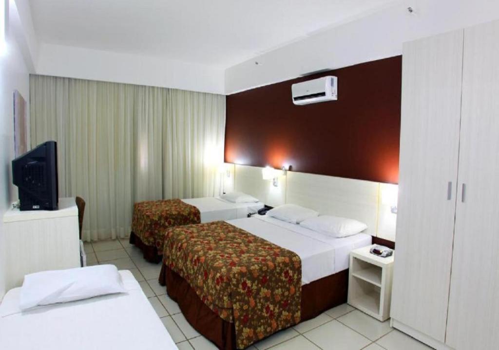Cama ou camas em um quarto em Apartamento Le Jardin