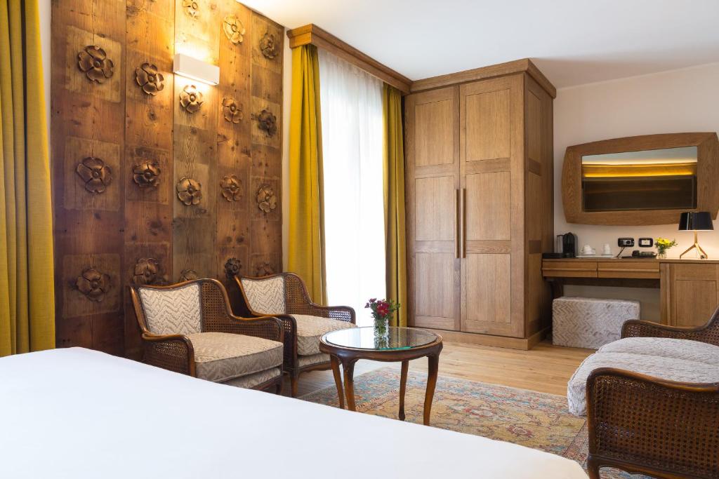 Postel nebo postele na pokoji v ubytování Duca D'Aosta Hotel