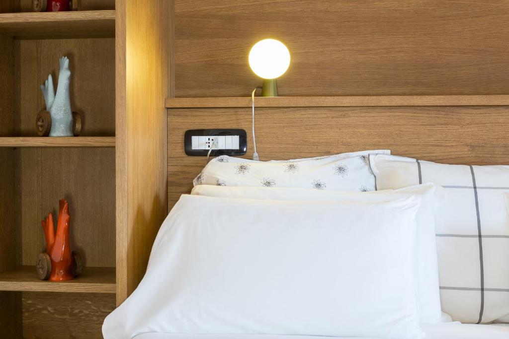 Postel nebo postele na pokoji v ubytování Duca D'Aosta Hotel