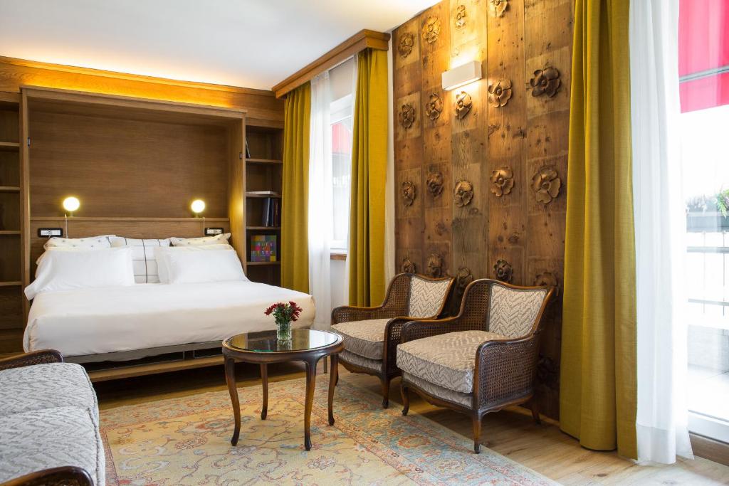 Postel nebo postele na pokoji v ubytování Duca D'Aosta Hotel
