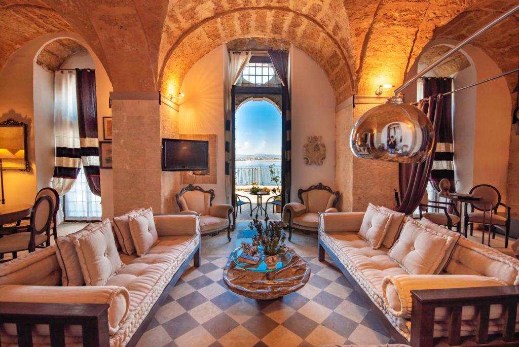 A seating area at Maniace Suites