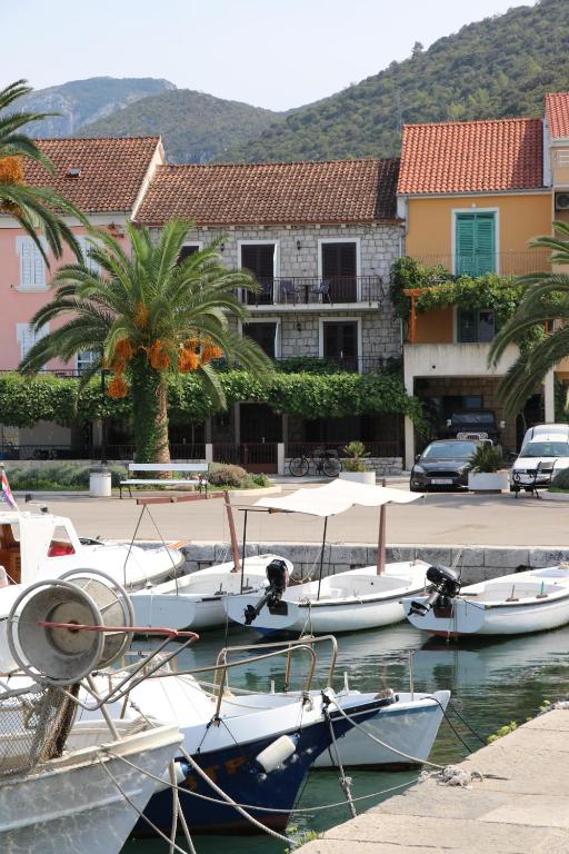 a group of boats are docked in a harbor at APARTMANI JURIĆ in Trpanj