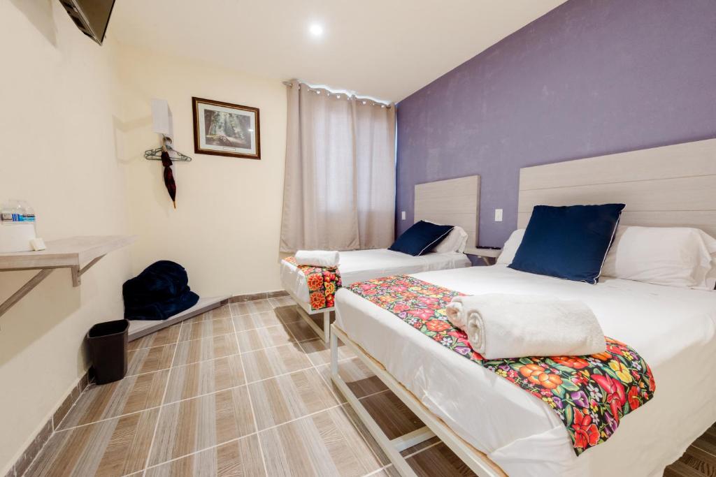 Postel nebo postele na pokoji v ubytování Hotel Hai Do