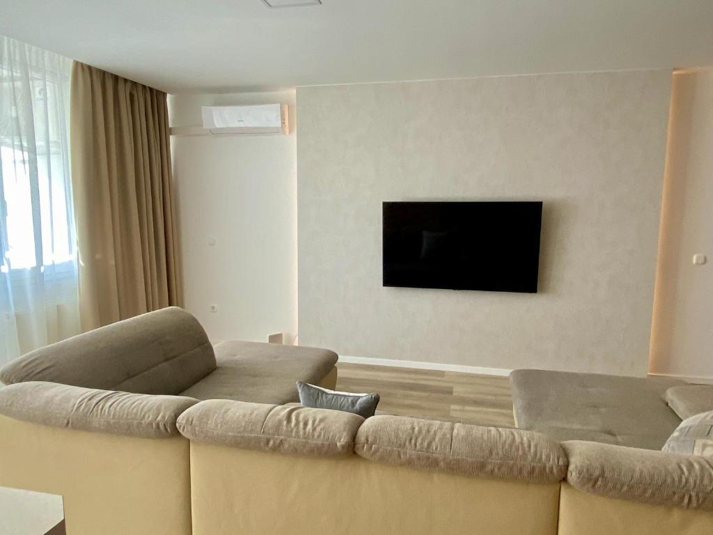 Televízia a/alebo spoločenská miestnosť v ubytovaní Bonita Apartman & Garage