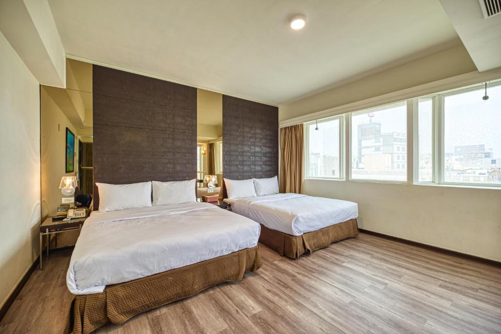 Postel nebo postele na pokoji v ubytování Jih Lih Hotel