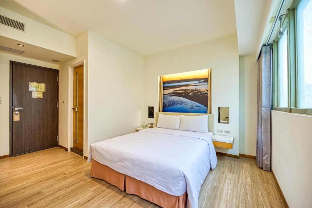 Postel nebo postele na pokoji v ubytování Jih Lih Hotel