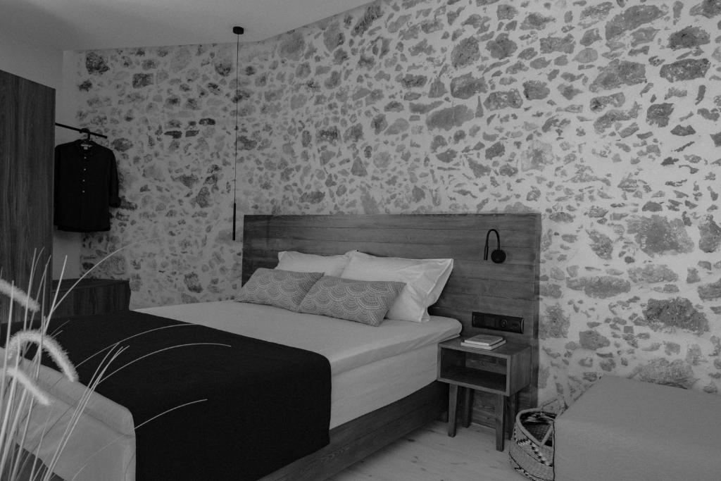 Posteľ alebo postele v izbe v ubytovaní Antigone's Stone House