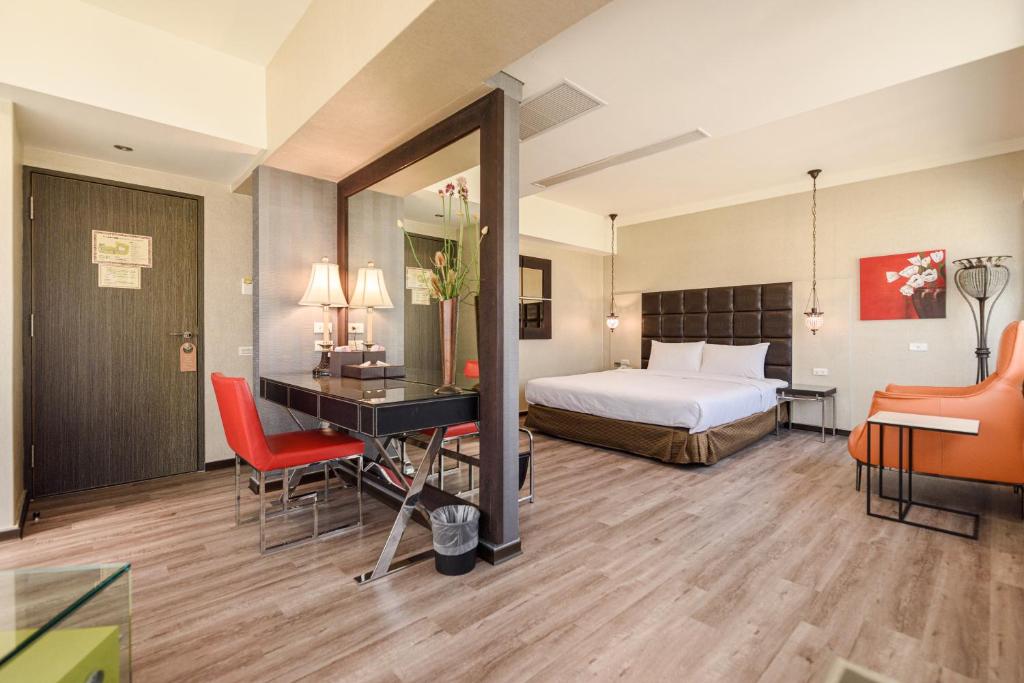 Postel nebo postele na pokoji v ubytování Jih Lih Hotel