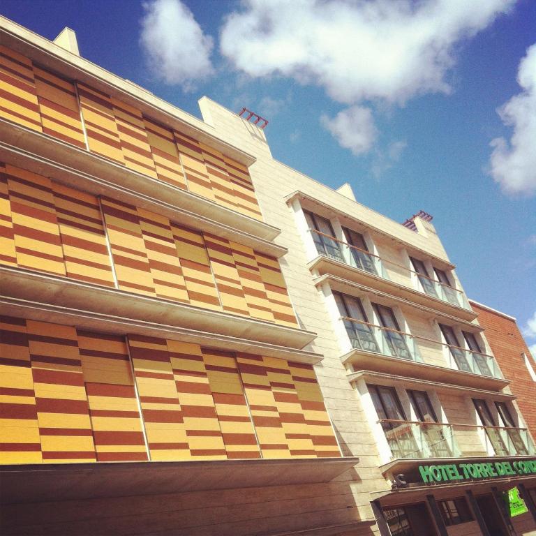 a building with wooden panels on the side of it at Hotel Torre Del Conde in San Sebastián de la Gomera