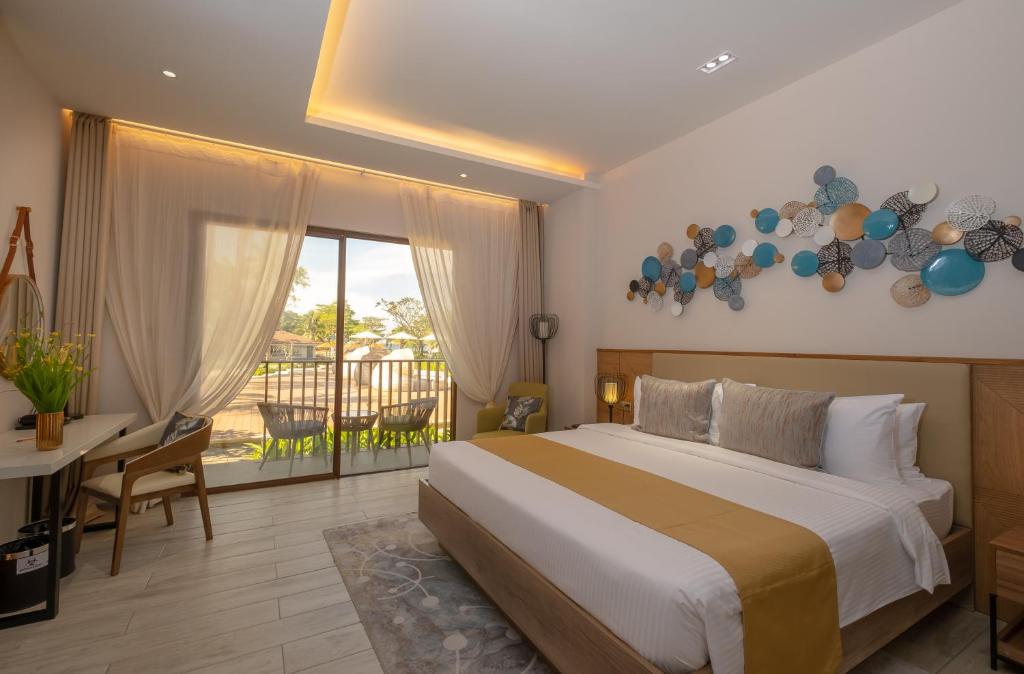 Postel nebo postele na pokoji v ubytování Nouveau Resort