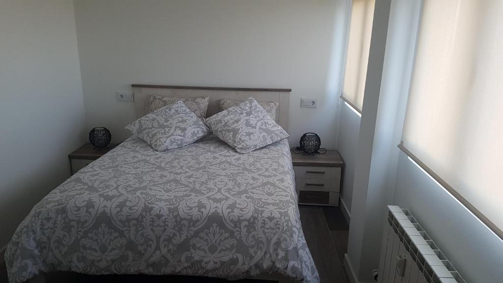 Postel nebo postele na pokoji v ubytování Precioso apartamento con magníficas vistas - Apartamento Aifos