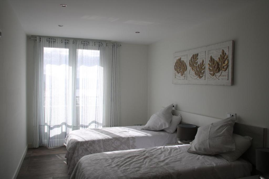 Postel nebo postele na pokoji v ubytování Precioso apartamento con magníficas vistas - Apartamento Aifos