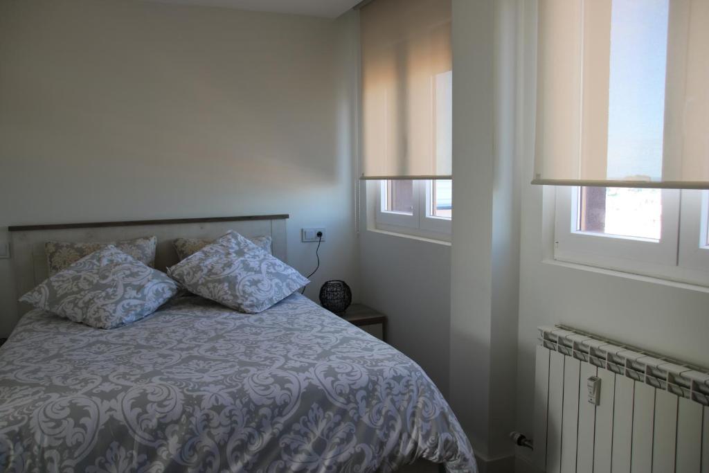Postel nebo postele na pokoji v ubytování Precioso apartamento con magníficas vistas - Apartamento Aifos
