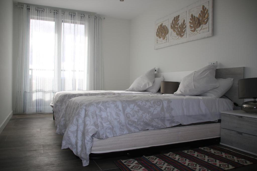 Postel nebo postele na pokoji v ubytování Precioso apartamento con magníficas vistas - Apartamento Aifos