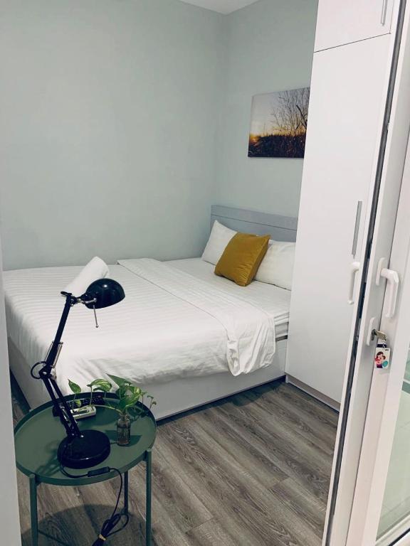 Giường trong phòng chung tại Moonlight House & Apartment Nha Trang