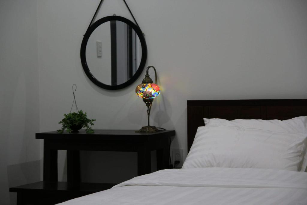 Giường trong phòng chung tại Moonlight House & Apartment Nha Trang
