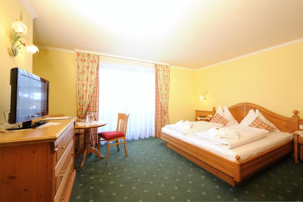 Posteľ alebo postele v izbe v ubytovaní Aparthotel Kristall