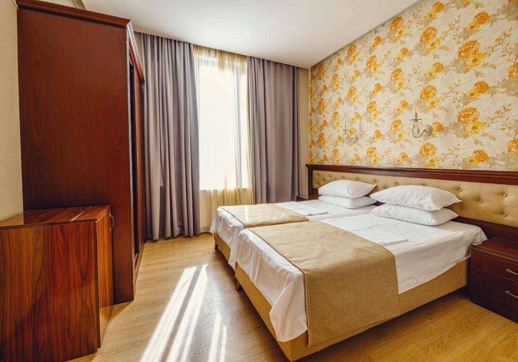 Postel nebo postele na pokoji v ubytování Park Hotel Tskaltubo - Balneo Resort