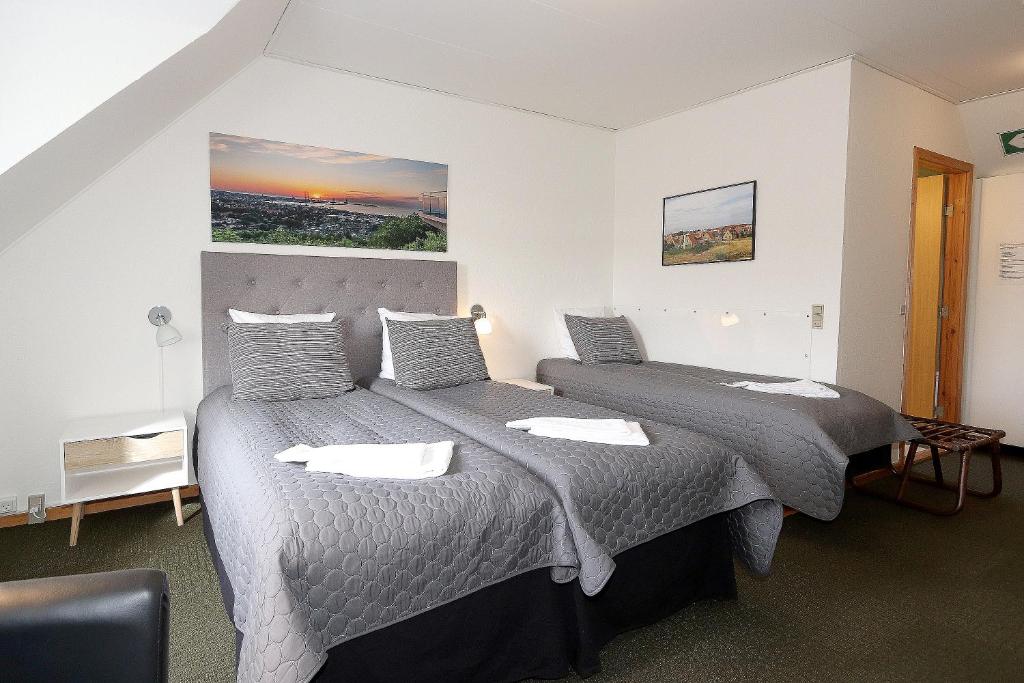 Postel nebo postele na pokoji v ubytování Svalereden Strand Camping Rooms