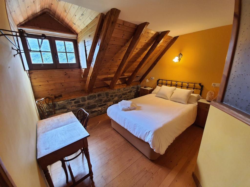 Postel nebo postele na pokoji v ubytování Posada Magoria