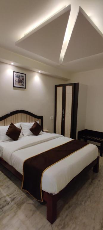 Postel nebo postele na pokoji v ubytování Rmc travellers inn