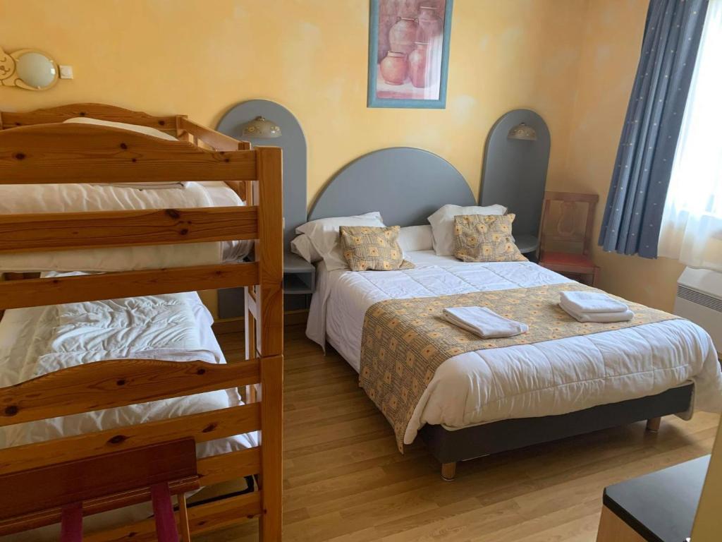 Postel nebo postele na pokoji v ubytování Auberge Champenoise