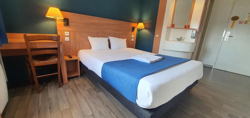 Postel nebo postele na pokoji v ubytování Glisy Hôtel