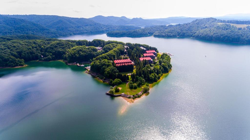 an island in the middle of a large body of water at Rewita Solina in Solina