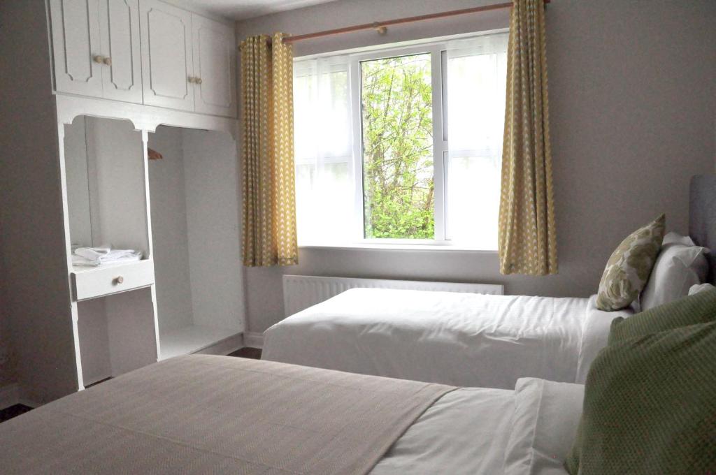 Postel nebo postele na pokoji v ubytování Killilagh House Accommodation