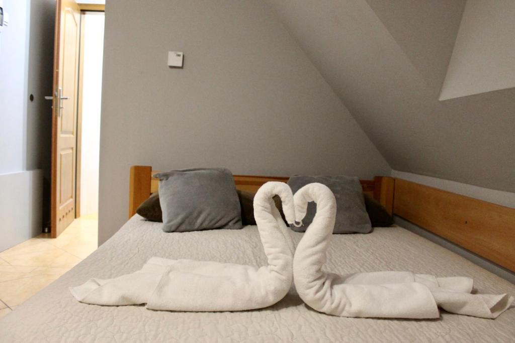 Posteľ alebo postele v izbe v ubytovaní Apartamenty Suzyw Pilsko