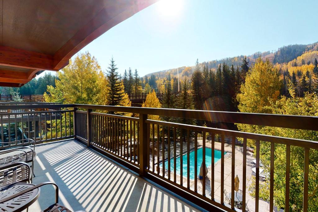 a balcony with a view of a swimming pool at Lion Square Lodge South 451 in Vail