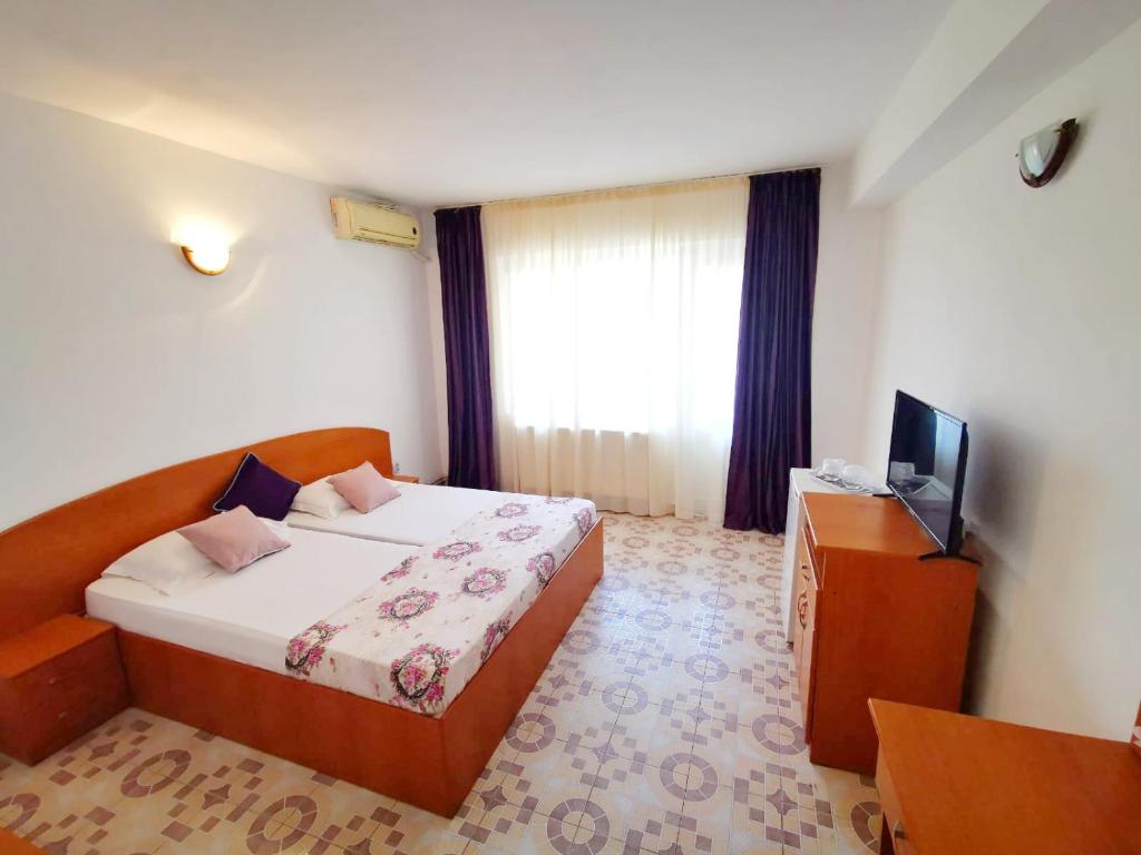 Postel nebo postele na pokoji v ubytování Berlin - Locatie Centrala
