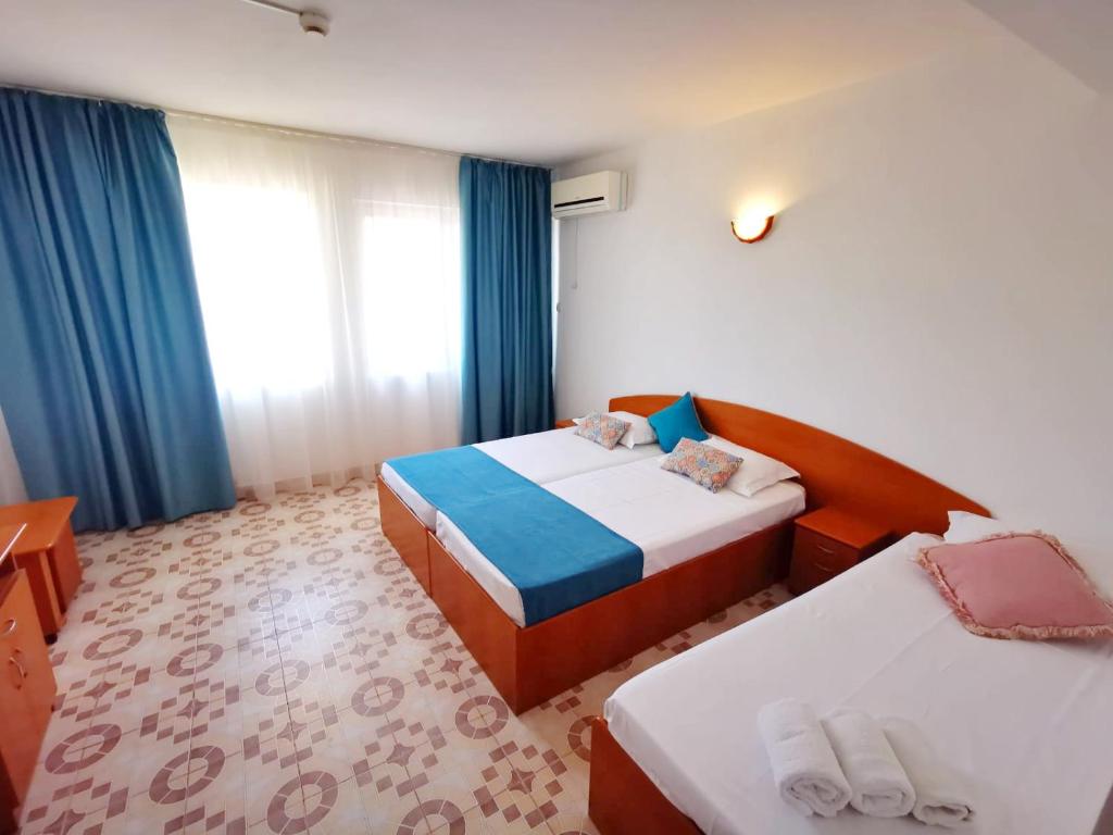 Postel nebo postele na pokoji v ubytování Berlin - Locatie Centrala