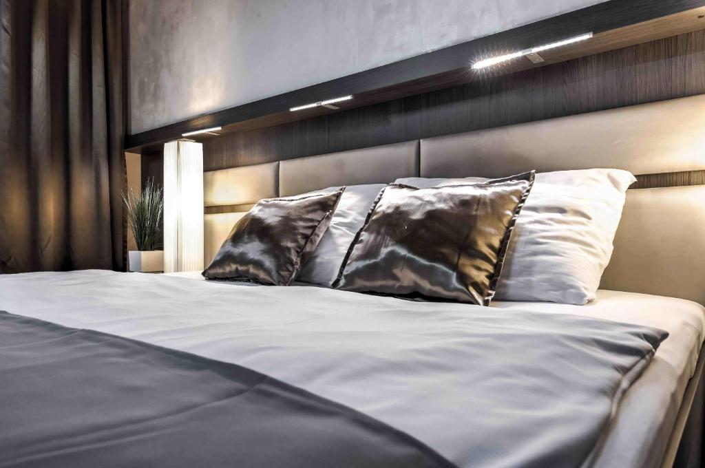 Postel nebo postele na pokoji v ubytování Volcano Spa Hotel