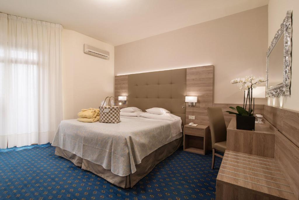 Postel nebo postele na pokoji v ubytování Hotel Garden Terme
