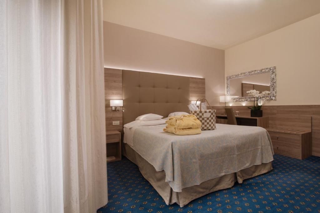 Postel nebo postele na pokoji v ubytování Hotel Garden Terme