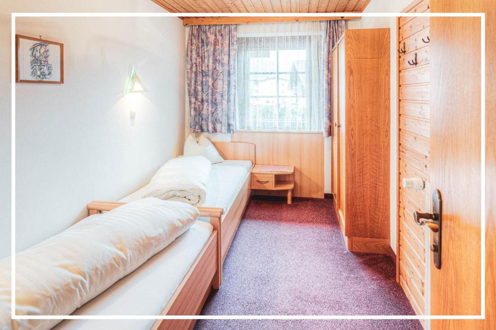 Postel nebo postele na pokoji v ubytování Gutshof - Urlaubsresort Hafele
