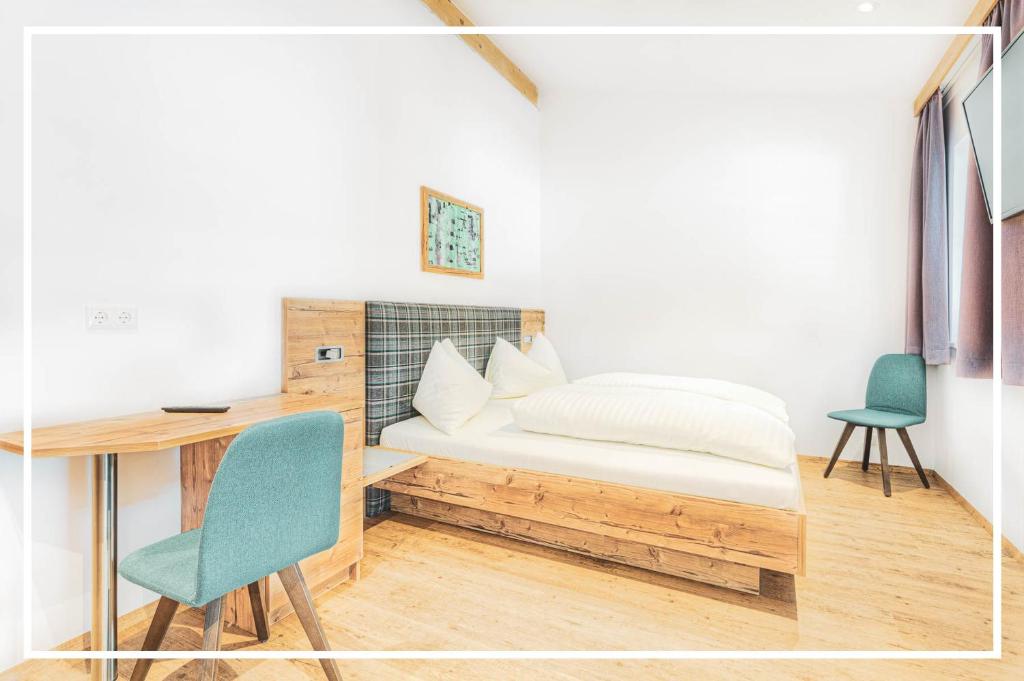 Postel nebo postele na pokoji v ubytování Tyrol Mountain Aparts - Urlaubsresort Hafele