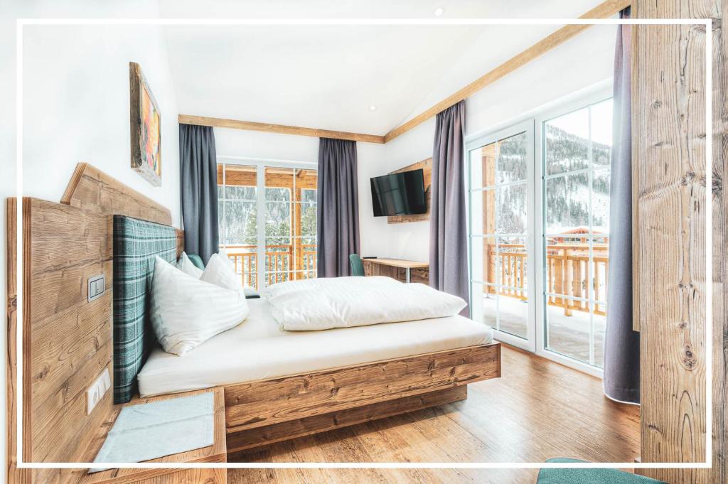 Postel nebo postele na pokoji v ubytování Tyrol Mountain Aparts - Urlaubsresort Hafele