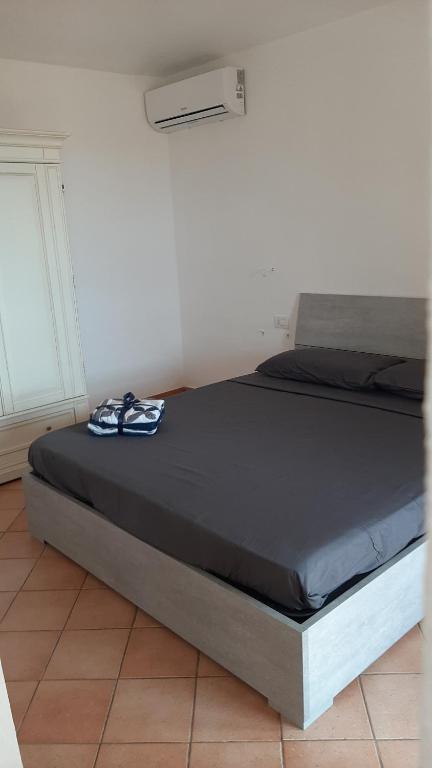 Postel nebo postele na pokoji v ubytování Appartamento Residence Mirice Vignola mare Aglientu casa Mattia