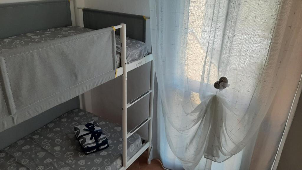 Postel nebo postele na pokoji v ubytování Appartamento Residence Mirice Vignola mare Aglientu casa Mattia