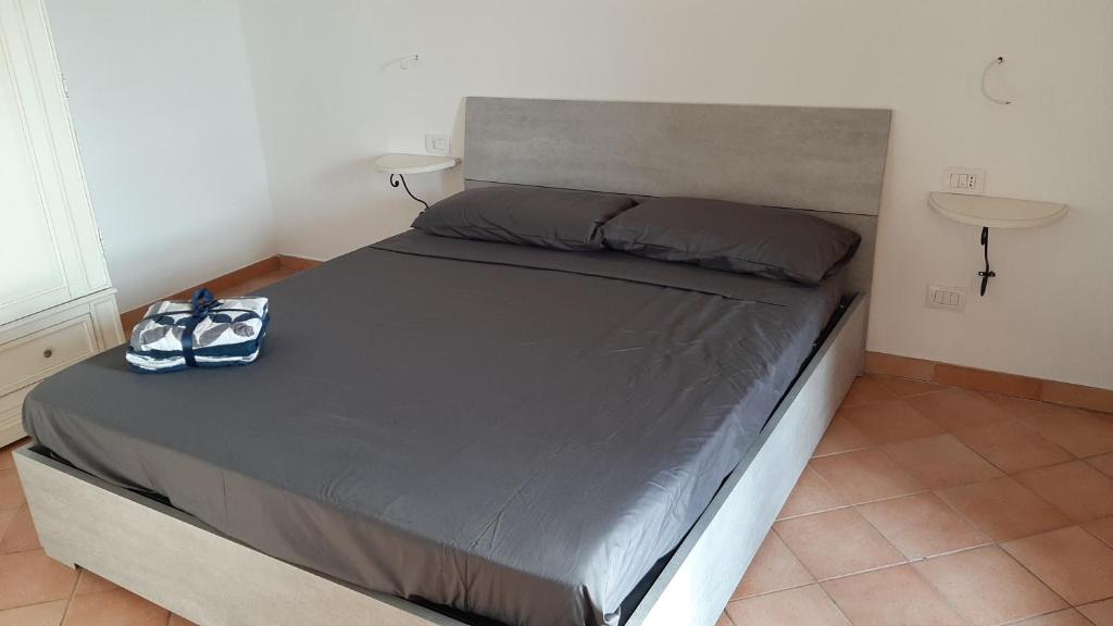 Postel nebo postele na pokoji v ubytování Appartamento Residence Mirice Vignola mare Aglientu casa Mattia
